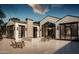 Backyard featuring a modern water feature, patio, and large windows at 5636 E Caballo Dr, Paradise Valley, AZ 85253