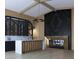 Stylish bar with a wine rack and a modern fireplace with marble surround at 5636 E Caballo Dr, Paradise Valley, AZ 85253