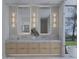 Bright bathroom with natural light, dual sink vanity, and large mirrors at 5636 E Caballo Dr, Paradise Valley, AZ 85253