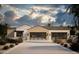 Home with modern garage doors, desert landscaping, and a concrete driveway at 5636 E Caballo Dr, Paradise Valley, AZ 85253