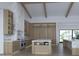 Spacious kitchen with marble island, custom wood cabinetry, and high-end stainless steel appliances at 5636 E Caballo Dr, Paradise Valley, AZ 85253