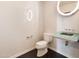 Modern powder bathroom with glass sink, white textured wallpaper, and a unique mirror at 6803 E Main St # 4415, Scottsdale, AZ 85251