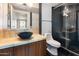 Modern bathroom featuring a vessel sink, wood vanity, and glass enclosed shower at 6803 E Main St # 4415, Scottsdale, AZ 85251