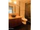 Modern bathroom featuring a vessel sink, dark tile flooring, and glass enclosed shower at 6803 E Main St # 4415, Scottsdale, AZ 85251