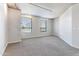 Bedroom with neutral carpet, two windows, and white walls and ceiling at 6803 E Main St # 4415, Scottsdale, AZ 85251