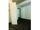 Bedroom with dark carpet and open closet space at 6803 E Main St # 4415, Scottsdale, AZ 85251