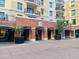 Exterior view of the building's entrance with well-maintained landscaping and architectural details at 6803 E Main St # 4415, Scottsdale, AZ 85251