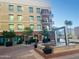 Modern apartment complex with a fountain and well-maintained landscaping, creating an inviting curb appeal at 6803 E Main St # 4415, Scottsdale, AZ 85251