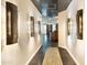 Hallway with decorative lights, and floor tiling leading to the kitchen and living room at 6803 E Main St # 4415, Scottsdale, AZ 85251