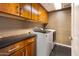 Well-equipped laundry room features ample cabinetry and modern washer and dryer, maximizing efficiency and storage at 6803 E Main St # 4415, Scottsdale, AZ 85251
