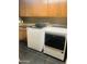 Laundry room featuring side-by-side washer and dryer and storage cabinets at 6803 E Main St # 4415, Scottsdale, AZ 85251