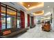 Elegant lobby featuring large windows, tile floors, seating, and stylish interior design elements at 6803 E Main St # 4415, Scottsdale, AZ 85251