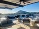 Relaxing rooftop lounge area with comfortable seating, stylish decor, scenic mountain views, and beautiful blue skies at 6803 E Main St # 4415, Scottsdale, AZ 85251