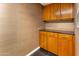 Convenient storage with custom wood cabinets, offering organization and functionality for any modern home at 6803 E Main St # 4415, Scottsdale, AZ 85251