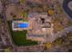 Aerial view of a luxury home with a pool, putting green, and landscaped grounds at 7130 E Navarro Way, Scottsdale, AZ 85266