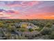Desert home boasts a private pool, covered structure, putting green, and mature desert landscaping at 7130 E Navarro Way, Scottsdale, AZ 85266