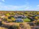 Expansive estate featuring a modern home, pool with cabana, and lush landscaping against a scenic mountain backdrop at 7130 E Navarro Way, Scottsdale, AZ 85266