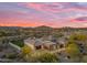 New home construction showcasing a large lot, three car garage, modern design, and desert views at 7130 E Navarro Way, Scottsdale, AZ 85266
