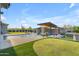 Stunning backyard featuring a pool, waterfalls, spa, and putting green for outdoor entertainment at 7130 E Navarro Way, Scottsdale, AZ 85266