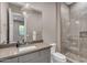 Bathroom with modern fixtures, including a glass-enclosed shower, a stylish sink, and elegant lighting at 7130 E Navarro Way, Scottsdale, AZ 85266