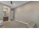 Bedroom with neutral paint, ceiling fan and access to ensuite bathroom at 7130 E Navarro Way, Scottsdale, AZ 85266