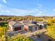 Exterior view of a modern home with a multi-car garage, desert landscaping, and scenic mountain views at 7130 E Navarro Way, Scottsdale, AZ 85266