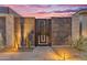 A decorative metal gate offers privacy and curb appeal at 7130 E Navarro Way, Scottsdale, AZ 85266