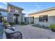Front courtyard featuring custom hardscape, decorative plants, outdoor seating, and contemporary design at 7130 E Navarro Way, Scottsdale, AZ 85266