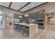 Stunning kitchen features a large island with seating, modern appliances, and stylish gray cabinetry at 7130 E Navarro Way, Scottsdale, AZ 85266