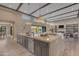 Open concept kitchen with a large island, pendant lighting, and access to the living area at 7130 E Navarro Way, Scottsdale, AZ 85266