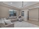 Open-concept living room boasts modern chandelier and couch at 7130 E Navarro Way, Scottsdale, AZ 85266
