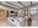 Spacious open-concept living room with fireplace, high ceilings, and modern design at 7130 E Navarro Way, Scottsdale, AZ 85266