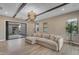 Open living room features ceiling beams, recessed lighting and a sliding glass door to the outdoor space at 7130 E Navarro Way, Scottsdale, AZ 85266