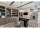 Office with custom built-in shelving, a modern desk, chair, decorative rug, and a stylish chandelier at 7130 E Navarro Way, Scottsdale, AZ 85266