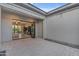 Outdoor patio with string lights and a large opening into the living room at 7130 E Navarro Way, Scottsdale, AZ 85266