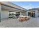 An outdoor patio showcases dining and lounge furniture with an open layout to the home's interior at 7130 E Navarro Way, Scottsdale, AZ 85266