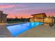 Luxury pool with a covered patio, lounge chairs, and a beautifully landscaped backyard at 7130 E Navarro Way, Scottsdale, AZ 85266