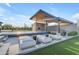 Luxurious pool area with cascading waterfall feature, sun loungers, and an outdoor kitchen for ultimate relaxation at 7130 E Navarro Way, Scottsdale, AZ 85266