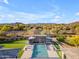 Resort-style pool with cabana, water features, and lounge area, set against a backdrop of scenic desert landscape at 7130 E Navarro Way, Scottsdale, AZ 85266