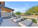 Inviting pool deck with comfortable sun loungers, an outdoor kitchen, and landscaped surroundings for backyard relaxation at 7130 E Navarro Way, Scottsdale, AZ 85266