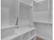 White walk-in closet with custom shelving provides ample storage space at 7130 E Navarro Way, Scottsdale, AZ 85266