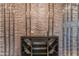 Custom-built wine cellar with stone accent wall and built-in wine storage racks at 7130 E Navarro Way, Scottsdale, AZ 85266