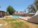 Backyard with stone pavers, outdoor kitchen and a view of the swimming pool at 7232 N 22 Nd St, Phoenix, AZ 85020
