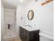 Bathroom featuring a modern vanity, walk-in shower, and neutral decor at 7232 N 22 Nd St, Phoenix, AZ 85020