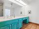 Bathroom featuring a long vanity, a large mirror, and tiled floors at 7232 N 22 Nd St, Phoenix, AZ 85020