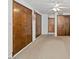Bright bedroom with carpet floors and large wood-paneled closets and a ceiling fan at 7232 N 22 Nd St, Phoenix, AZ 85020