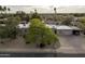 Single story home with a mature shade tree in the front yard, large driveway at 7232 N 22 Nd St, Phoenix, AZ 85020