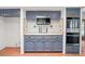 View of blue kitchen cabinets with tile floors and stainless steel appliances at 7232 N 22 Nd St, Phoenix, AZ 85020