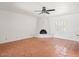 Spacious living room with tile floors and a brick fireplace at 7232 N 22 Nd St, Phoenix, AZ 85020