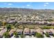 Stunning aerial view showcasing a neighborhood with mountain views, green spaces, and well-maintained homes at 737 E Harwell Rd, Phoenix, AZ 85042
